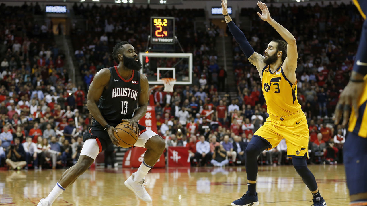 HOUSTON, TX - DECEMBER 17: James Harden #13 of the Houston Rockets pulls up to take a three point shot defended by Ricky Rubio #3 of the Utah Jazz in the second half at Toyota Center on December 17, 2018 in Houston, Texas.
