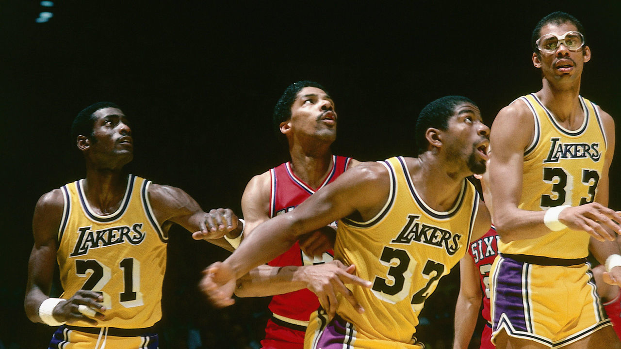 INGLEWOOD, CA - 1980: Julius Erving #6 of the Philadelphia 76ers battles for rebound position against Magic Johnson #32 of the Los Angeles Lakers during an NBA game at the Great Western Forum in Inglewood, California. NOTE TO USER: User expressly acknowledges and agrees that, by downloading and/or using this Photograph, user is consenting to the terms and conditions of the Getty Images License Agreement. Mandatory Copyright Notice: Copyright 1980 NBAE
