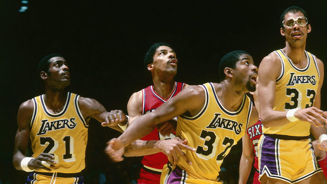 INGLEWOOD, CA - 1980: Julius Erving #6 of the Philadelphia 76ers battles for rebound position against Magic Johnson #32 of the Los Angeles Lakers during an NBA game at the Great Western Forum in Inglewood, California. NOTE TO USER: User expressly acknowledges and agrees that, by downloading and/or using this Photograph, user is consenting to the terms and conditions of the Getty Images License Agreement. Mandatory Copyright Notice: Copyright 1980 NBAE
