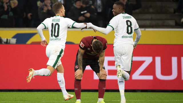 18 December 2018, North Rhine-Westphalia, Mönchengladbach: Soccer: Bundesliga, Bor. Mönchengladbach - 1st FC Nuremberg, 16th matchday at Borussia-Park. Gladbach's Thorgan Hazard and Denis Zakaria celebrate the 1-0 victory. Photo: Federico Gambarini/dpa - IMPORTANT NOTE: In accordance with the requirements of the DFL Deutsche Fußball Liga or the DFB Deutscher Fußball-Bund, it is prohibited to use or have used photographs taken in the stadium and/or the match in the form of sequence images and/or video-like photo sequences.