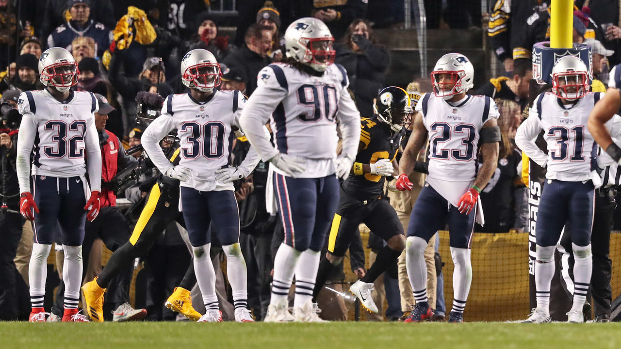 PITTSBURGH, PA - DECEMBER 16: From left, New England Patriots defenders Devin McCourty (32), Jason McCourty (30), Malcolm Brown (90), Patrick Chung (23) and Jonathan Jones (31) react after Steelers wide receiver Antonio Brown (84, background) had just caught a touchdown pass against them. The New England Patriots visit the Pittsburgh Steelers in a regular season NFL football game at Heinz Field in Pittsburgh, PA on Dec. 16, 2018.
