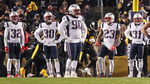 PITTSBURGH, PA - DECEMBER 16: From left, New England Patriots defenders Devin McCourty (32), Jason McCourty (30), Malcolm Brown (90), Patrick Chung (23) and Jonathan Jones (31) react after Steelers wide receiver Antonio Brown (84, background) had just caught a touchdown pass against them. The New England Patriots visit the Pittsburgh Steelers in a regular season NFL football game at Heinz Field in Pittsburgh, PA on Dec. 16, 2018.