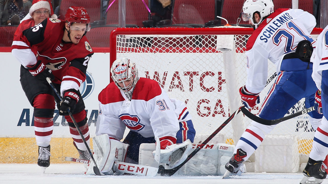 GLENDALE, ARIZONA - DECEMBER 20: Goaltender Carey Price #31 of the Montreal Canadiens makes a save on the puck as Nick Cousins #25 of the Arizona Coyotes skates in during the second period of the NHL game at Gila River Arena on December 20, 2018 in Glendale, Arizona.