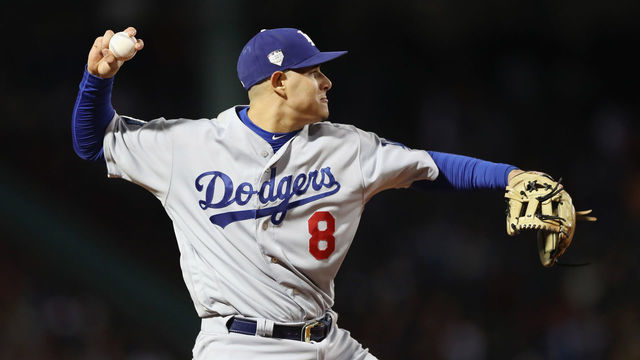 BOSTON, MA - OCTOBER 24: Manny Machado #8 of the Los Angeles Dodgers throws out J.D. Martinez (not pictured) #28 of the Boston Red Sox during the fourth inning in Game Two of the 2018 World Series at Fenway Park on October 24, 2018 in Boston, Massachusetts.