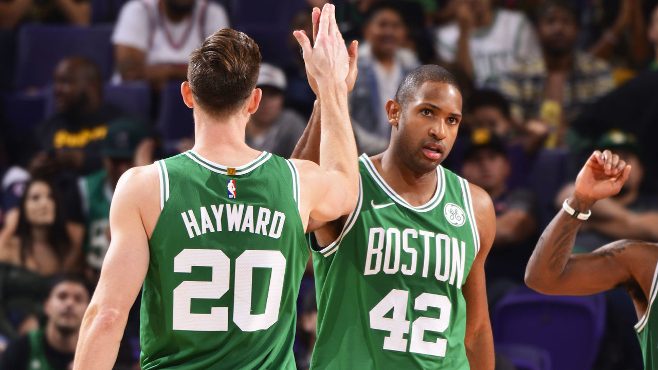 PHOENIX, AZ - NOVEMBER 8: Al Horford #42 of the Boston Celtics high-fives Gordon Hayward #20 of the Boston Celtics during the game against the Phoenix Suns on November 8, 2018 at Talking Stick Resort Arena in Phoenix, Arizona. Mandatory Copyright Notice: Copyright 2018 NBAE