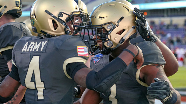 FORT WORTH, TX - DECEMBER 22: Army Black Knights quarterback Cam Thomas (4) celebrates with running back Jordan Asberry (3) after throwing him a touchdown pass during the Armed Forces Bowl between the Houston Cougars and Army Black Knights on December 22, 2018 at Amon G. Carter Stadium in Fort Worth, TX.