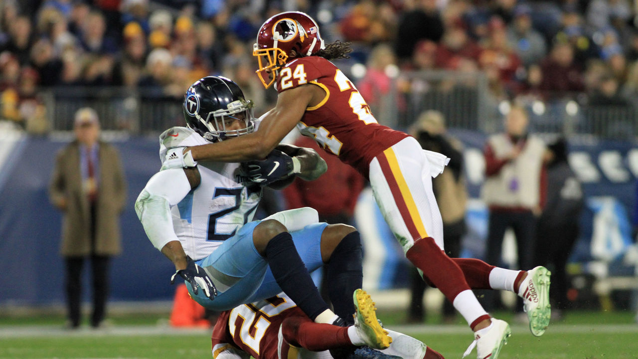 NASHVILLE, TN - DECEMBER 22: Tennessee Titans Running Back Derrick Henry (22) is tackled by Washington Redskins Cornerback Josh Norman (24) in the second half of a game between the Tennessee Titans and Washington Redskins, December 22, 2018, at Nissan Stadium in Nashville, Tennessee.