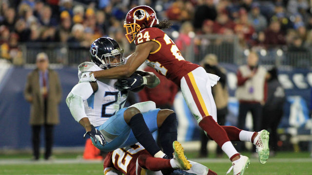 NASHVILLE, TN - DECEMBER 22: Tennessee Titans Running Back Derrick Henry (22) is tackled by Washington Redskins Cornerback Josh Norman (24) in the second half of a game between the Tennessee Titans and Washington Redskins, December 22, 2018, at Nissan Stadium in Nashville, Tennessee.