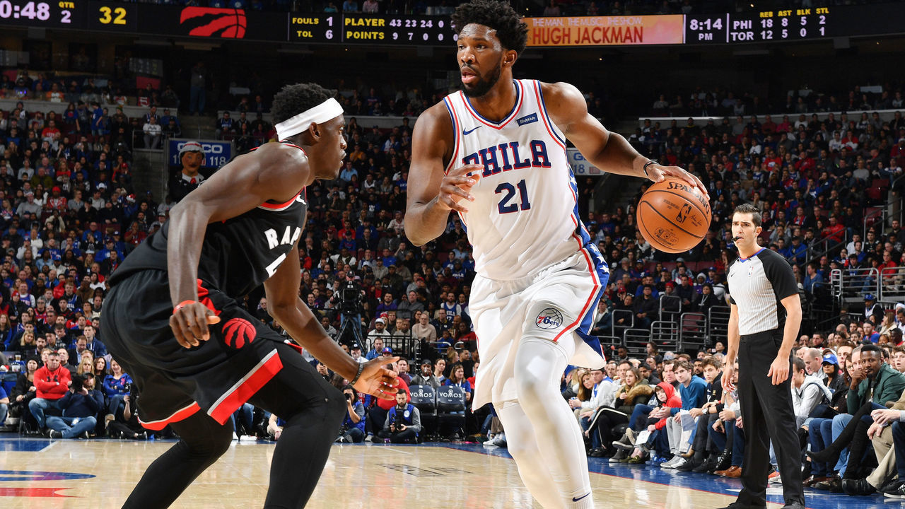 PHILADELPHIA, PA - DECEMBER 22: Joel Embiid #21 of the Philadelphia 76ers handles the ball against Pascal Siakam #43 of the Toronto Raptors on December 22, 2018 at the Wells Fargo Center in Philadelphia, Pennsylvania NOTE TO USER: User expressly acknowledges and agrees that, by downloading and/or using this Photograph, user is consenting to the terms and conditions of the Getty Images License Agreement. Mandatory Copyright Notice: Copyright 2018 NBAE