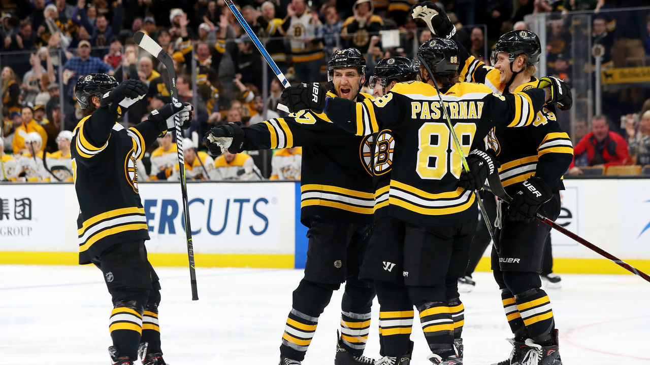BOSTON, MASSACHUSETTS - DECEMBER 22: Patrice Bergeron #37 of the Boston Bruins celebrates with teammates after scoring against the Nashville Predators during the third period at TD Garden on December 22, 2018 in Boston, Massachusetts. The Bruins defeat the Predators 5-2.