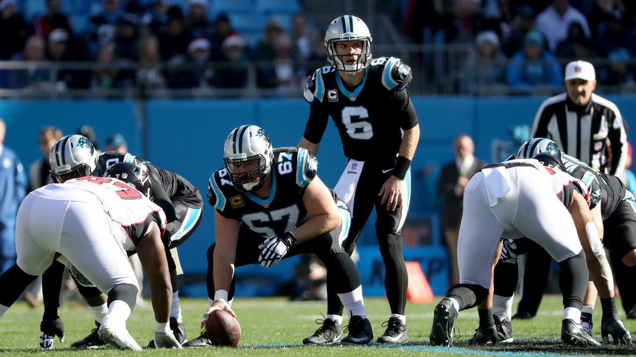 CHARLOTTE, NORTH CAROLINA - DECEMBER 23: Taylor Heinicke #6 of the Carolina Panthers makes a call at the line against the in the first quarter during their game at Bank of America Stadium on December 23, 2018 in Charlotte, North Carolina.