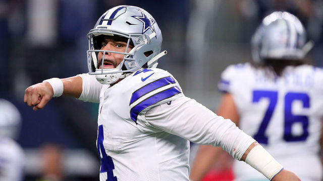 ARLINGTON, TEXAS - DECEMBER 23: Dak Prescott #4 of the Dallas Cowboys reacts after throwing a touchdown pass against the Tampa Bay Buccaneers in the third quarter at AT&T Stadium on December 23, 2018 in Arlington, Texas.