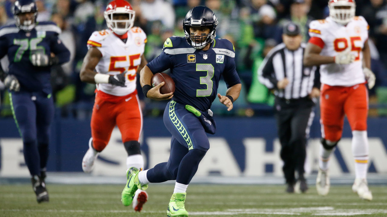 SEATTLE, WA - DECEMBER 23: Quarterback Russell Wilson #3 of the Seattle Seahawks rushes for a first down during the first quarter of the game against the Kansas City Chiefs at CenturyLink Field on December 23, 2018 in Seattle, Washington.