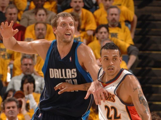 OAKLAND, CA - MAY 3: Dirk Nowitzki #41 of the Dallas Mavericks calls for the ball while covered by Matt Barnes #22 of the Golden State Warriors in Game Six of the Western Conference Quarterfinals during the 2007 NBA Playoffs at Oracle Arena on March 3, 2007 in Oakland, California. The Warriors won 111-86 to clinch the series 4-2. NOTE TO USER: User expressly acknowledges and agrees that, by downloading and/or using this Photograph, user is consenting to the terms and conditions of the Getty Images License Agreement. Mandatory Copyright Notice: Copyright 2007 NBAE