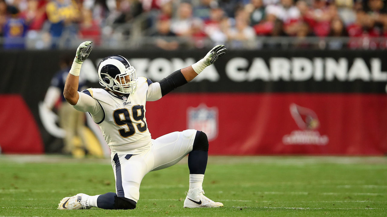 GLENDALE, ARIZONA - DECEMBER 23: Defensive end Aaron Donald #99 of the Los Angeles Rams celebrates after a sack against the Arizona Cardinals during the second half of the NFL game at State Farm Stadium on December 23, 2018 in Glendale, Arizona. The Rams defeated the Cardinals 31-9.