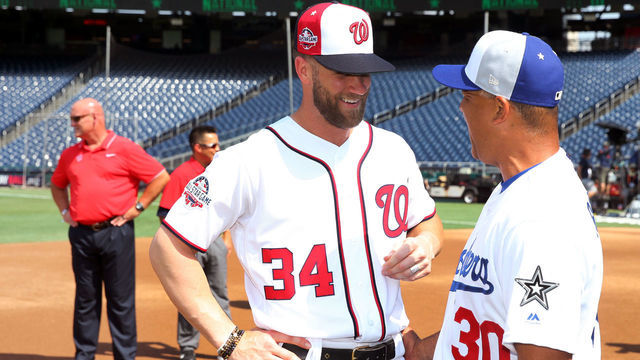 WASHINGTON, D.C. - JULY 16: Bryce Harper #34 of the Washington Nationals laughs with manager Dave Roberts #30 Los Angeles Dodgers during the Gatorade All-Star Workout Day at Nationals Park on Monday, July 16, 2018 in Washington, D.C.