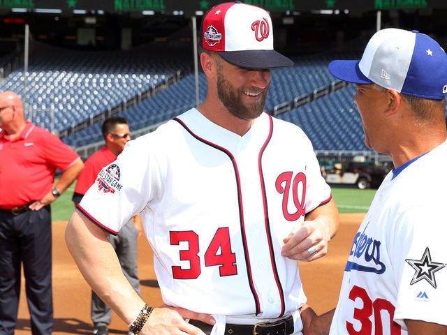 WASHINGTON, D.C. - JULY 16: Bryce Harper #34 of the Washington Nationals laughs with manager Dave Roberts #30 Los Angeles Dodgers during the Gatorade All-Star Workout Day at Nationals Park on Monday, July 16, 2018 in Washington, D.C.