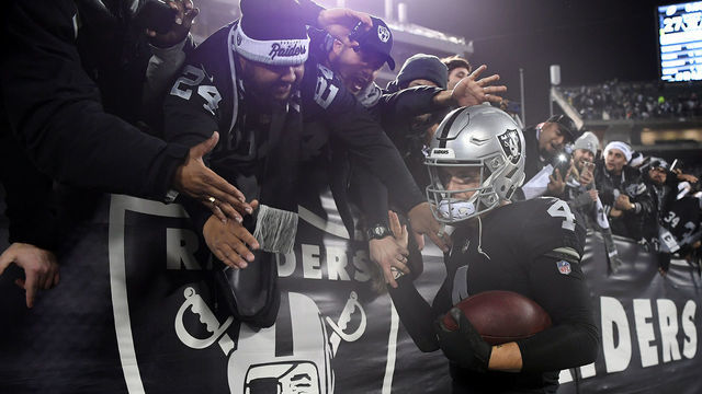 OAKLAND, CA - DECEMBER 24: Derek Carr #4 of the Oakland Raiders greets fans in the stands after their 27-14 win over the Denver Broncos in what may be the final Raiders game at the Oakland-Alameda County Coliseum on December 24, 2018 in Oakland, California.