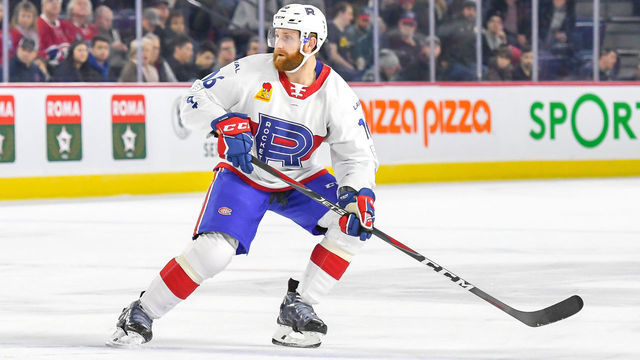 LAVAL, QC, CANADA - DECEMBER 15: Karl Alzner #16 of the Laval Rocket shifting direction against the Syracuse Crunch at Place Bell on December 15, 2018 in Laval, Quebec.