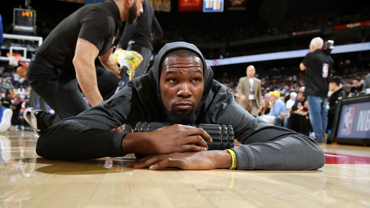 OAKLAND, CA - DECEMBER 25: Kevin Durant #35 of the Golden State Warriors stretches prior to a game against the Los Angeles Lakers on December 25, 2018 at ORACLE Arena in Oakland, California. NOTE TO USER: User expressly acknowledges and agrees that, by downloading and or using this photograph, user is consenting to the terms and conditions of Getty Images License Agreement. Mandatory Copyright Notice: Copyright 2018 NBAE