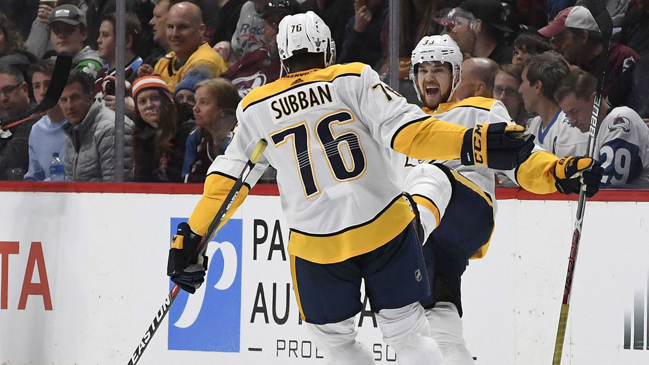 DENVER, CO - APRIL 22: Nashville Predators left wing Viktor Arvidsson #33, right, celebrates his goal against the Colorado Avalanche with teammates defenseman P.K. Subban #76 and Nashville Predators left wing Filip Forsberg #9 in the third period during game 6 of round one of the Stanley Cup Playoffs at the Pepsi Center April 22, 2018. Colorado Avalanche defenseman Patrik Nemeth #12, left, skates behind the group. The Avs lost 5-0, the Predators won the series 4-2.