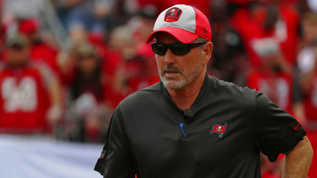 TAMPA, FLORIDA - DECEMBER 02: Head coach Dirk Koetter of the Tampa Bay Buccaneers runs out to the field before a football game against the Carolina Panthers at Raymond James Stadium on December 02, 2018 in Tampa, Florida.