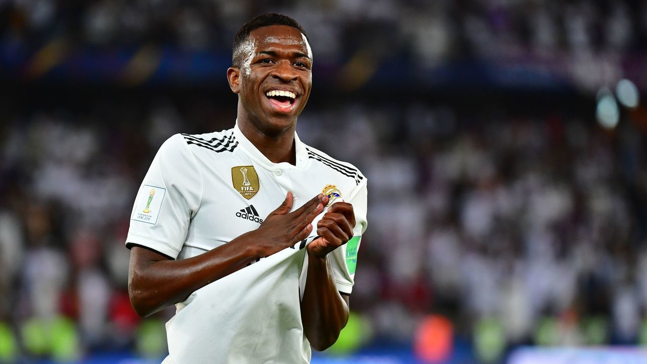 Real Madrid's Brazilian forward Vinicius Junior (L) celebrates an own goal by Al-Ain's midfielder Yahya Nader (unseen) during the FIFA Club World Cup final football match Spain's Real Madrid vs Abu Dhabi's Al Ain at the Zayed Sports City Stadium in Abu Dhabi, the capital of the United Arab Emirates, on December 22, 2018.