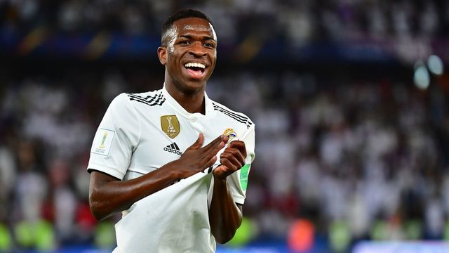 Real Madrid's Brazilian forward Vinicius Junior (L) celebrates an own goal by Al-Ain's midfielder Yahya Nader (unseen) during the FIFA Club World Cup final football match Spain's Real Madrid vs Abu Dhabi's Al Ain at the Zayed Sports City Stadium in Abu Dhabi, the capital of the United Arab Emirates, on December 22, 2018.