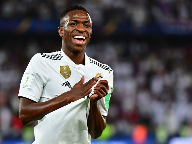 Real Madrid's Brazilian forward Vinicius Junior (L) celebrates an own goal by Al-Ain's midfielder Yahya Nader (unseen) during the FIFA Club World Cup final football match Spain's Real Madrid vs Abu Dhabi's Al Ain at the Zayed Sports City Stadium in Abu Dhabi, the capital of the United Arab Emirates, on December 22, 2018.