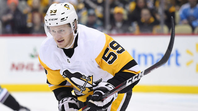PITTSBURGH, PA - DECEMBER 17: Pittsburgh Penguins Right Wing Jake Guentzel (59) skates during the first period in the NHL game between the Pittsburgh Penguins and the Anaheim Ducks on December 17, 2018, at PPG Paints Arena in Pittsburgh, PA.