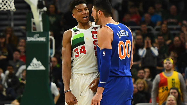 MILWAUKEE, WISCONSIN - DECEMBER 27: Giannis Antetokounmpo #34 of the Milwaukee Bucks and Enes Kanter #00 of the New York Knicks exchange words during the second half of a game at Fiserv Forum on December 27, 2018 in Milwaukee, Wisconsin. Enes Kanter #00 was ejected from the game.