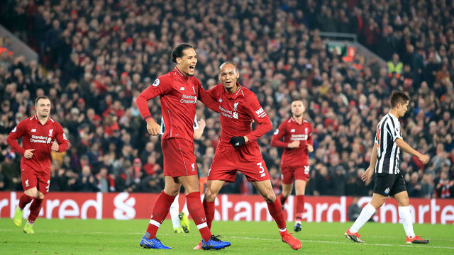 Liverpool's Fabinho (right) celebrates scoring his side's fourth goal of the game with Virgil van Dijk during the Premier League match at Anfield, Liverpool.