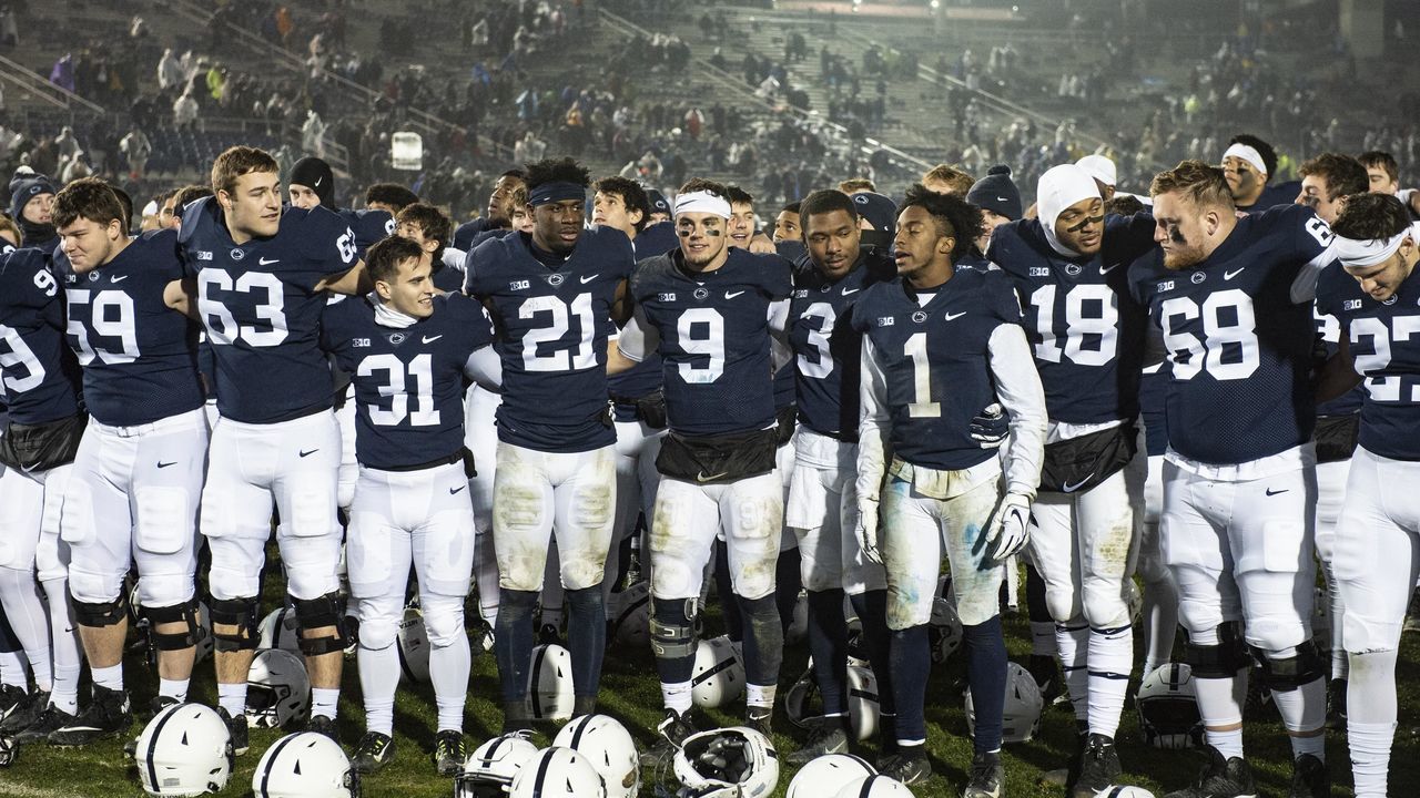 UNIVERSITY PARK, PA - NOVEMBER 24: Penn State Nittany Lions Quarterback Trace McSorley (9) and Penn State Nittany Lions Cornerback Amani Oruwariye (21) and Penn State Nittany Lions Wide Receiver KJ Hamler (1) gather near the band with teammates to enjoy their final game at home after the Maryland Terrapins versus the Penn State Nittany Lions on November 24, 2018, at Beaver Stadium in University Park, PA.