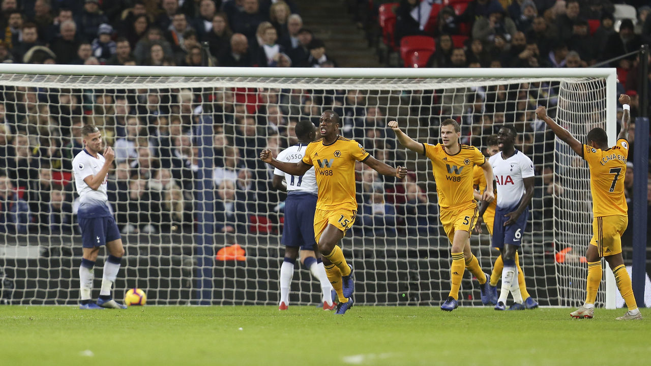 LONDON, ENGLAND - DECEMBER 29: Willy Boly of Wolverhampton Wanderers celebrates after scoring a goal to make it 1-1 during the Premier League match between Tottenham Hotspur and Wolverhampton Wanderers at Wembley Stadium on December 29, 2018 in London, United Kingdom.