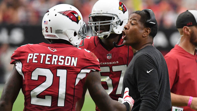 GLENDALE, AZ - SEPTEMBER 23: Head coach Steve Wilks of the Arizona Cardinals talks with Patrick Peterson #21 during the first half of a game against the Chicago Bears at State Farm Stadium on September 23, 2018 in Glendale, Arizona.