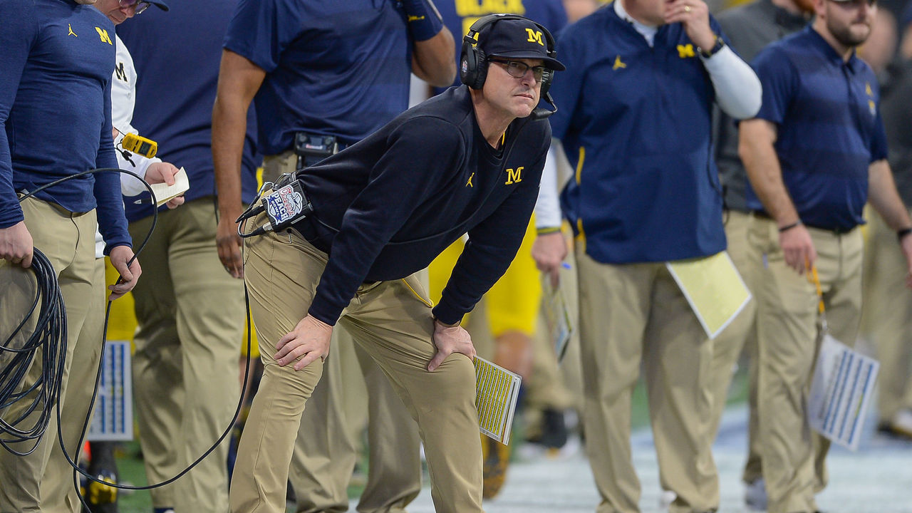 ATLANTA, GA DECEMBER 29: Michigan head coach Jim Harbaugh watches form the sideline during the first half of the Chick-fil-A Peach Bowl between the Michigan Wolverines and the Florida Gators on December 29th, 2018 at Mercedes-Benz Stadium in Atlanta, GA.