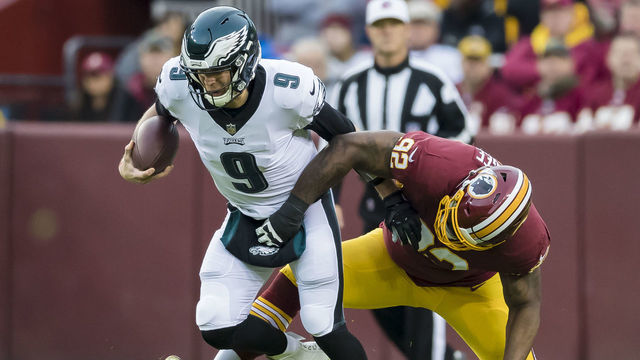 LANDOVER, MD - DECEMBER 30: Stacy McGee #92 of the Washington Redskins tackles Nick Foles #9 of the Philadelphia Eagles during the first half at FedExField on December 30, 2018 in Landover, Maryland.