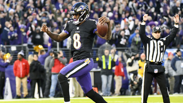 BALTIMORE, MD - DECEMBER 30: Baltimore Ravens quarterback Lamar Jackson (8) runs for a touchdown in the first quarter against the Cleveland Browns on December 30, 2018, at M&T Bank Stadium in Baltimore, MD.