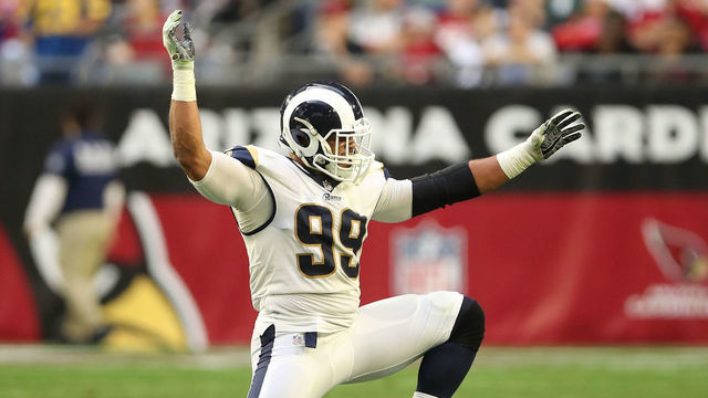 GLENDALE, ARIZONA - DECEMBER 23: Aaron Donald #99 of the Los Angeles Rams celebrates a sack in the second half of the NFL game against the Arizona Cardinals at State Farm Stadium on December 23, 2018 in Glendale, Arizona.