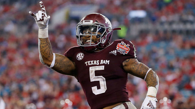 JACKSONVILLE, FL - DECEMBER 31: Trayveon Williams #5 of the Texas A&M Aggies celebrates after a touchdown against the North Carolina State Wolfpack during the second half of the TaxSlayer Gator Bowl at TIAA Bank Field on December 31, 2018 in Jacksonville, Florida.