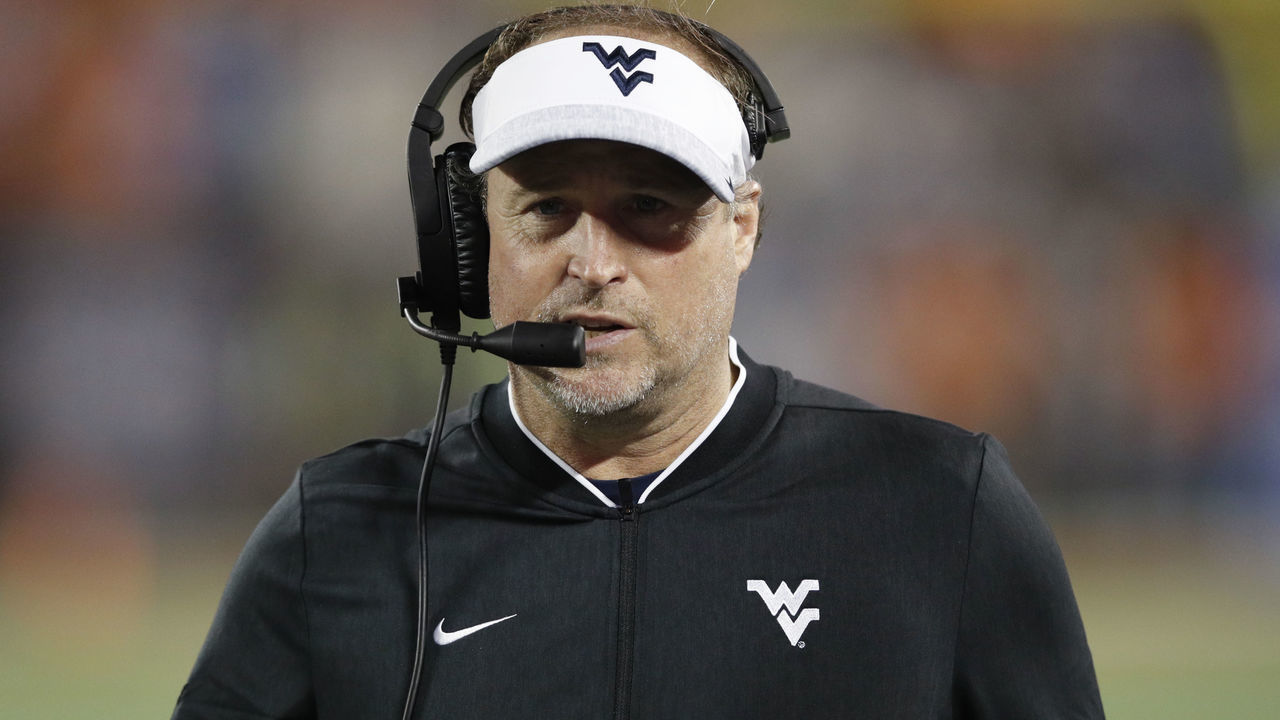 ORLANDO, FL - DECEMBER 28: Head coach Dana Holgorsen of the West Virginia Mountaineers looks on against the Syracuse Orange during the Camping World Bowl at Camping World Stadium on December 28, 2018 in Orlando, Florida. Syracuse won 34-18.