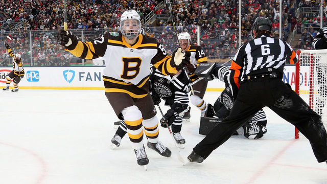 SOUTH BEND, IN - JANUARY 01: Sean Kuraly #52 of the Boston Bruins celebrates his go ahead goal to make it 3-2 against the Chicago Blackhawks during the third period of the 2019 Bridgestone NHL Winter Classic game at Notre Dame Stadium on January 1, 2019 in South Bend, Indiana.