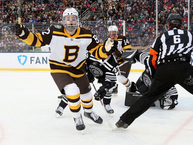 SOUTH BEND, IN - JANUARY 01: Sean Kuraly #52 of the Boston Bruins celebrates his go ahead goal to make it 3-2 against the Chicago Blackhawks during the third period of the 2019 Bridgestone NHL Winter Classic game at Notre Dame Stadium on January 1, 2019 in South Bend, Indiana.