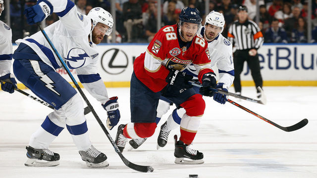 SUNRISE, FL - DECEMBER 1: Victor Hedman #77 of the Tampa Bay Lightning skates for possession against Mike Hoffman #68 of the Florida Panthers at the BB&T Center on December 1, 2018 in Sunrise, Florida.