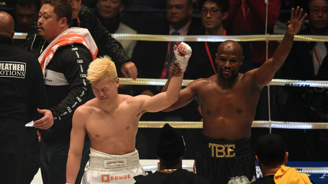 SAITAMA, JAPAN - DECEMBER 31: Floyd Mayweather of the United States (R) and Tenshin Nasukawa of Japan applaud each other after the RIZIN. 14 at Saitama Super Arena on December 31, 2018 in Saitama, Japan.