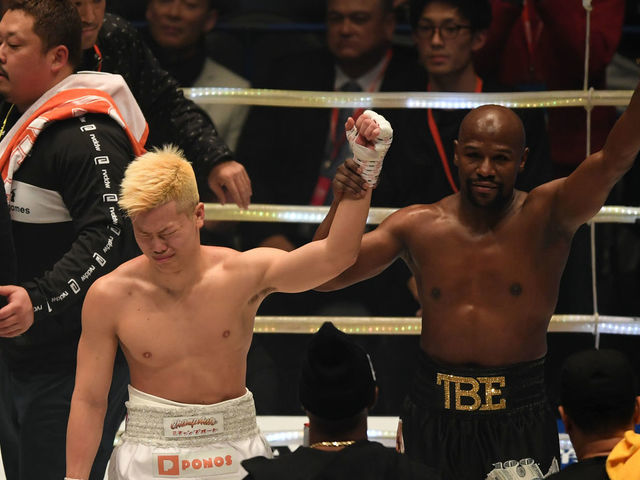 SAITAMA, JAPAN - DECEMBER 31: Floyd Mayweather of the United States (R) and Tenshin Nasukawa of Japan applaud each other after the RIZIN. 14 at Saitama Super Arena on December 31, 2018 in Saitama, Japan.