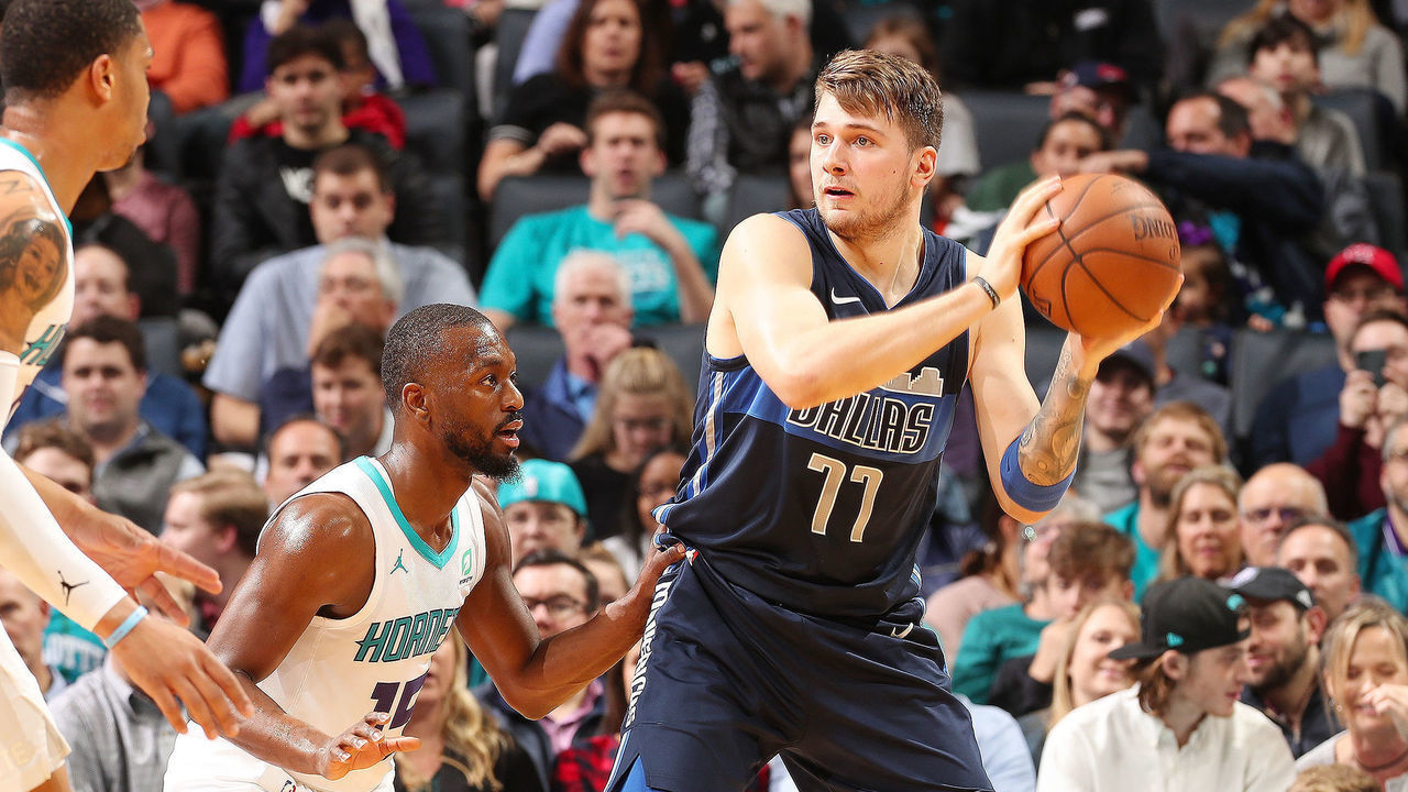 CHARLOTTE, NC - JANUARY 2: Luka Doncic #77 of the Dallas Mavericks passes the ball during the game against Kemba Walker #15 of the Charlotte Hornets on January 2, 2019 at Spectrum Center in Charlotte, North Carolina. Mandatory Copyright Notice: Copyright 2019 NBAE