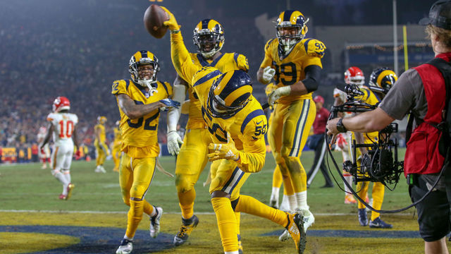 LOS ANGELES, CA - NOVEMBER 19: Los Angeles Rams outside linebacker Samson Ebukam (50) spikes the ball after he scores a touchdown during a NFL game between the Kansas City Chiefs and the Los Angeles Rams on November 19, 2018, at the Los Angeles Memorial Coliseum in Los Angeles, CA.