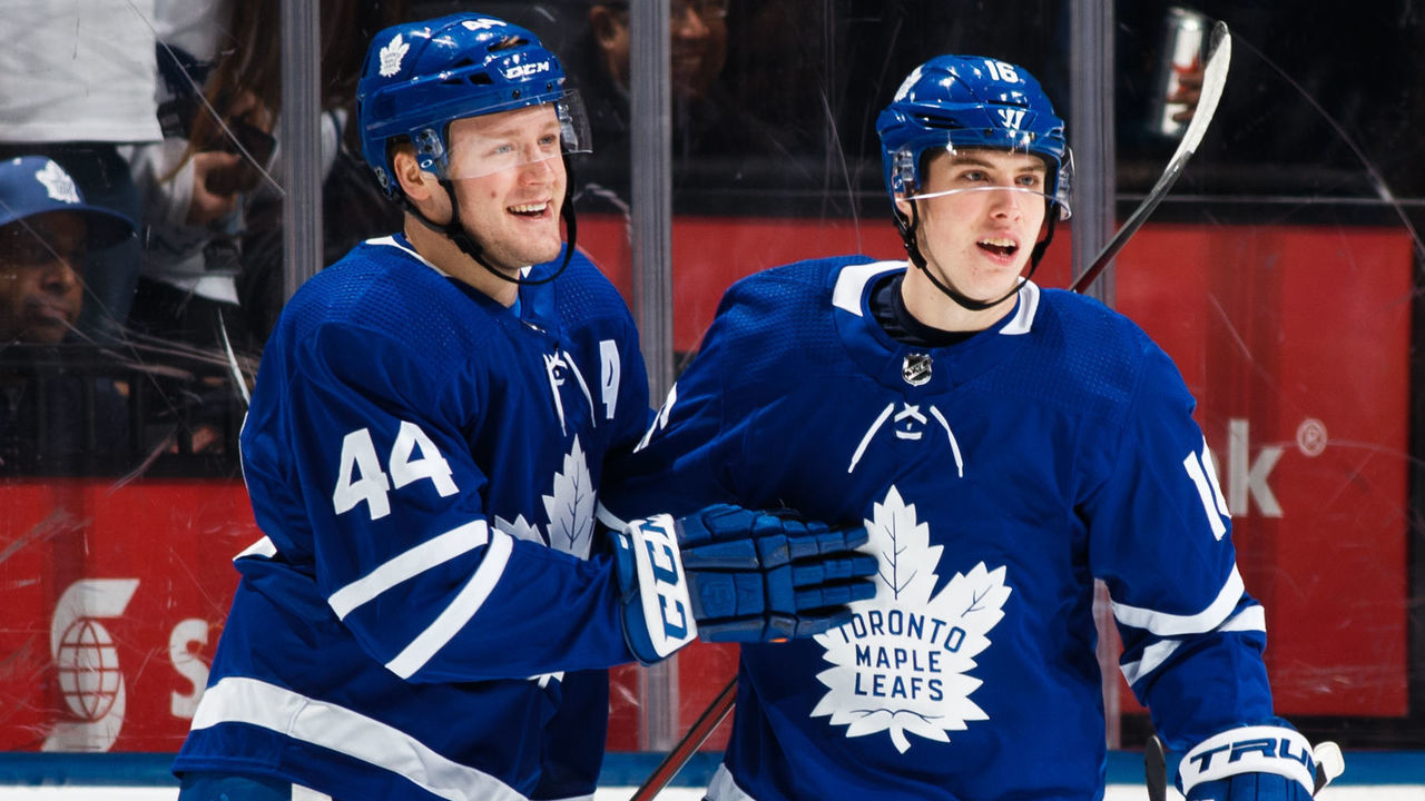 TORONTO, ON - MARCH 28: Mitch Marner #16 of the Toronto Maple Leafs celebrates with teammate Morgan Rielly #44 after scoring on the Florida Panthers during the first period at the Air Canada Centre on March 28, 2018 in Toronto, Ontario, Canada.