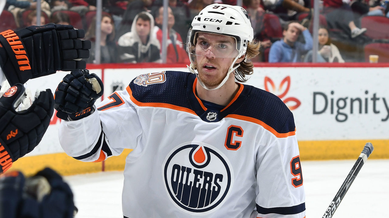 GLENDALE, AZ - JANUARY 02: Connor McDavid #97 of the Edmonton Oilers is congratulated by teammates after scoring a goal against the Arizona Coyotes during the second period at Gila River Arena on January 2, 2019 in Glendale, Arizona.